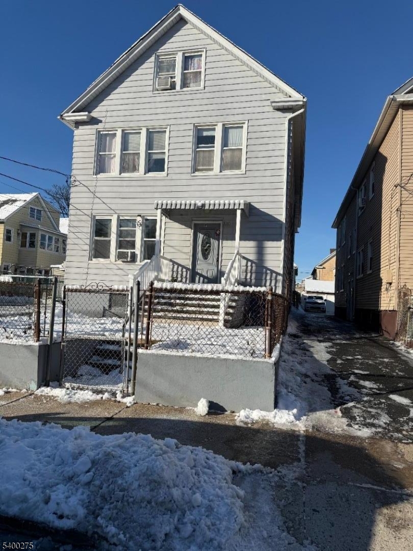 1010 Kilsyth Road Elizabeth, NJ 07208 - Photo 8 of 9 a front view of a house with a yard