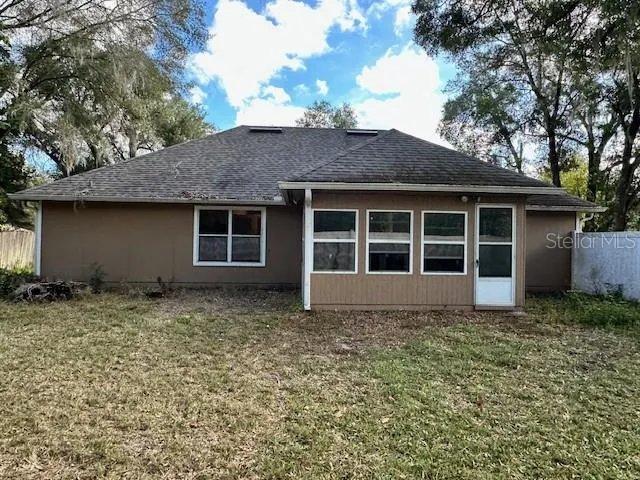 a house with trees in the background