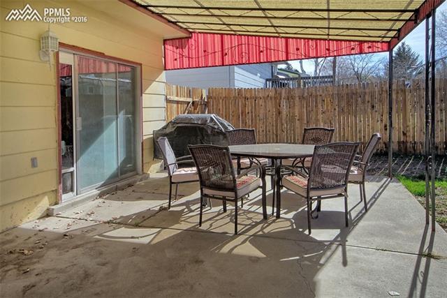 4735 Cheerful Road Colorado Springs, CO 80917 - Photo 23 of 25 Sliding glass door to covered patio for outdoor enjoyment