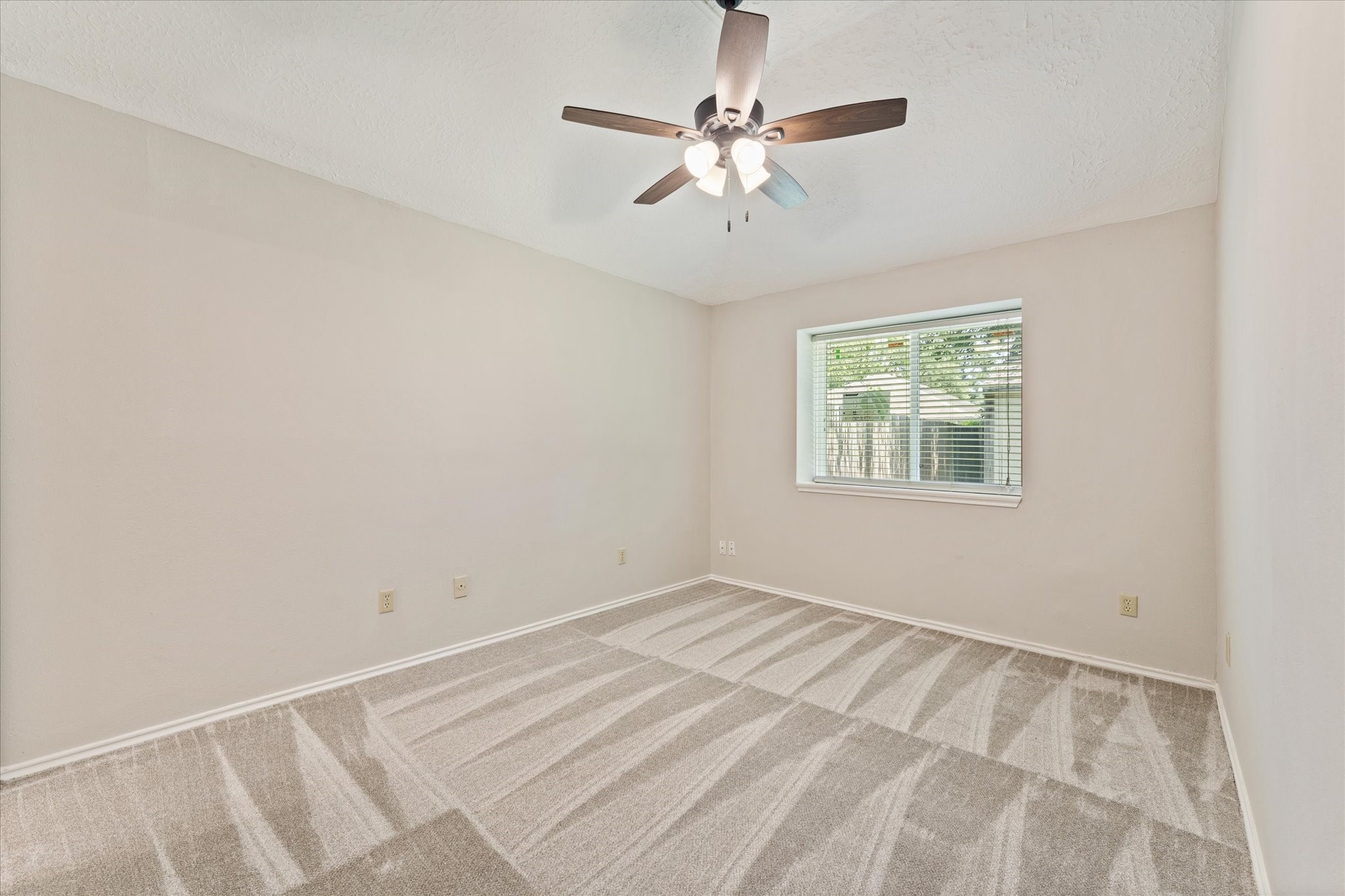 4906 Meadowfox Place Spring, TX 77389 - Photo 31 of 39 4th bedroom could be considered a second primary and has vaulted ceilings. Connects to the primary bathroom.