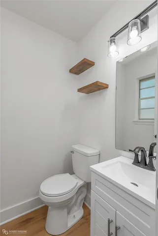 a bathroom with a toilet and a sink