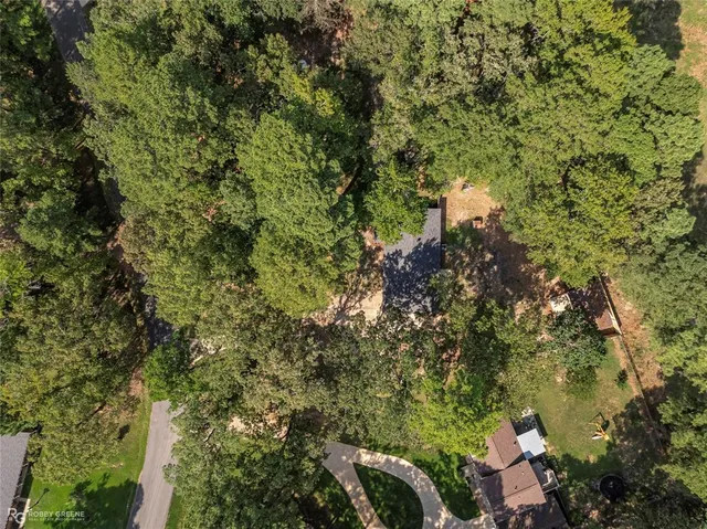 a view of a house with a tree