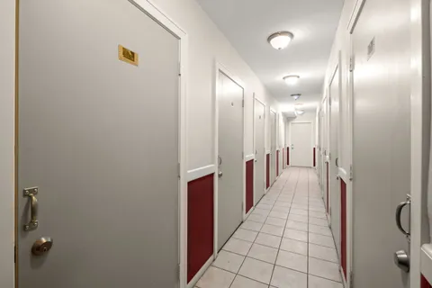 a view of a balcony with wooden floor