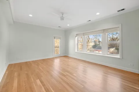 a kitchen with a refrigerator sink and cabinets