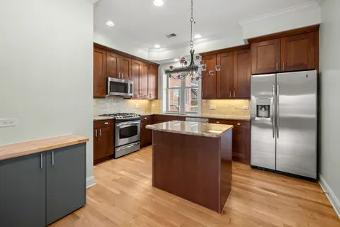 a view of a livingroom with a ceiling fan and window