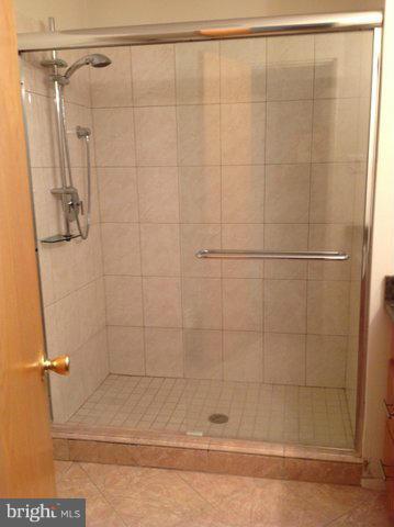 6221 Swords Way Bethesda, MD 20817 - Photo 11 of 12 a bathroom with a shower