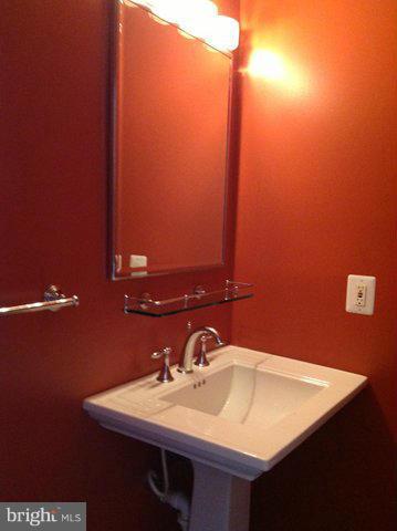 6221 Swords Way Bethesda, MD 20817 - Photo 12 of 12 a bathroom with a sink and a mirror