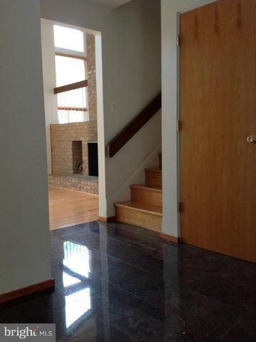6221 Swords Way Bethesda, MD 20817 - Photo 3 of 12 a view of entryway and hall with wooden floor