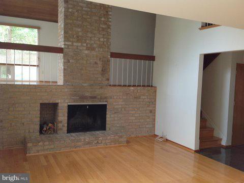 6221 Swords Way Bethesda, MD 20817 - Photo 4 of 12 a view of an empty room with a fireplace and a window