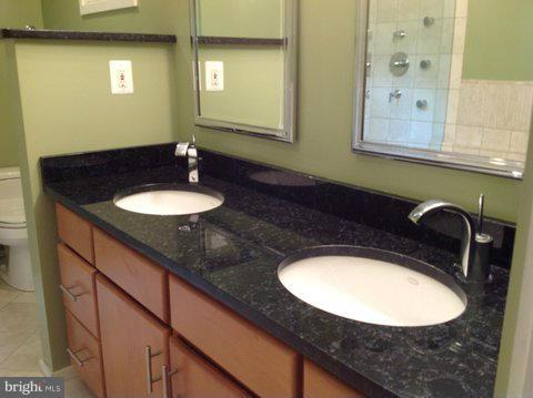 6221 Swords Way Bethesda, MD 20817 - Photo 8 of 12 a bathroom with a sink and a mirror