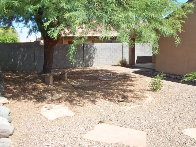 a view of a backyard of the house