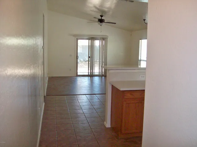 a view of a hallway with a chandelier