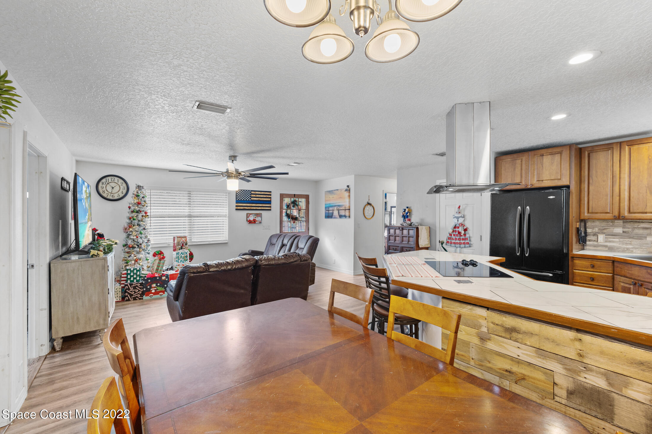 5480 Citrus Boulevard Cocoa, FL 32926 - Photo 11 of 43 a living room with furniture and a flat screen tv