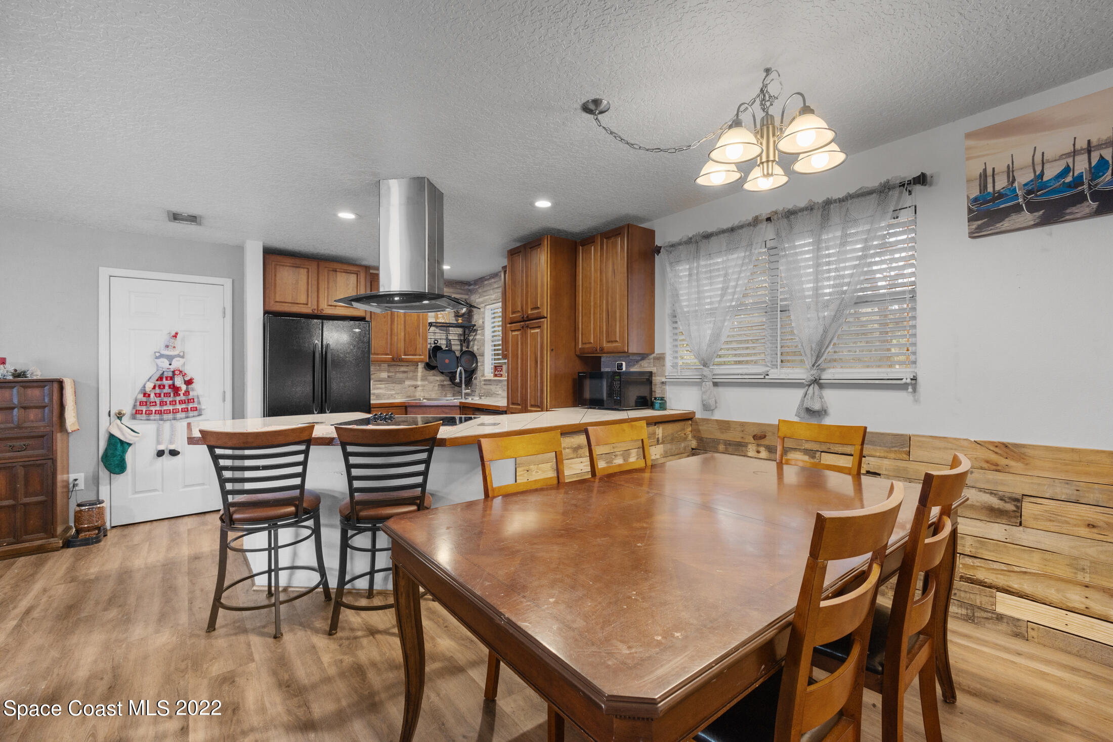 5480 Citrus Boulevard Cocoa, FL 32926 - Photo 12 of 43 a dining room with furniture and wooden floor