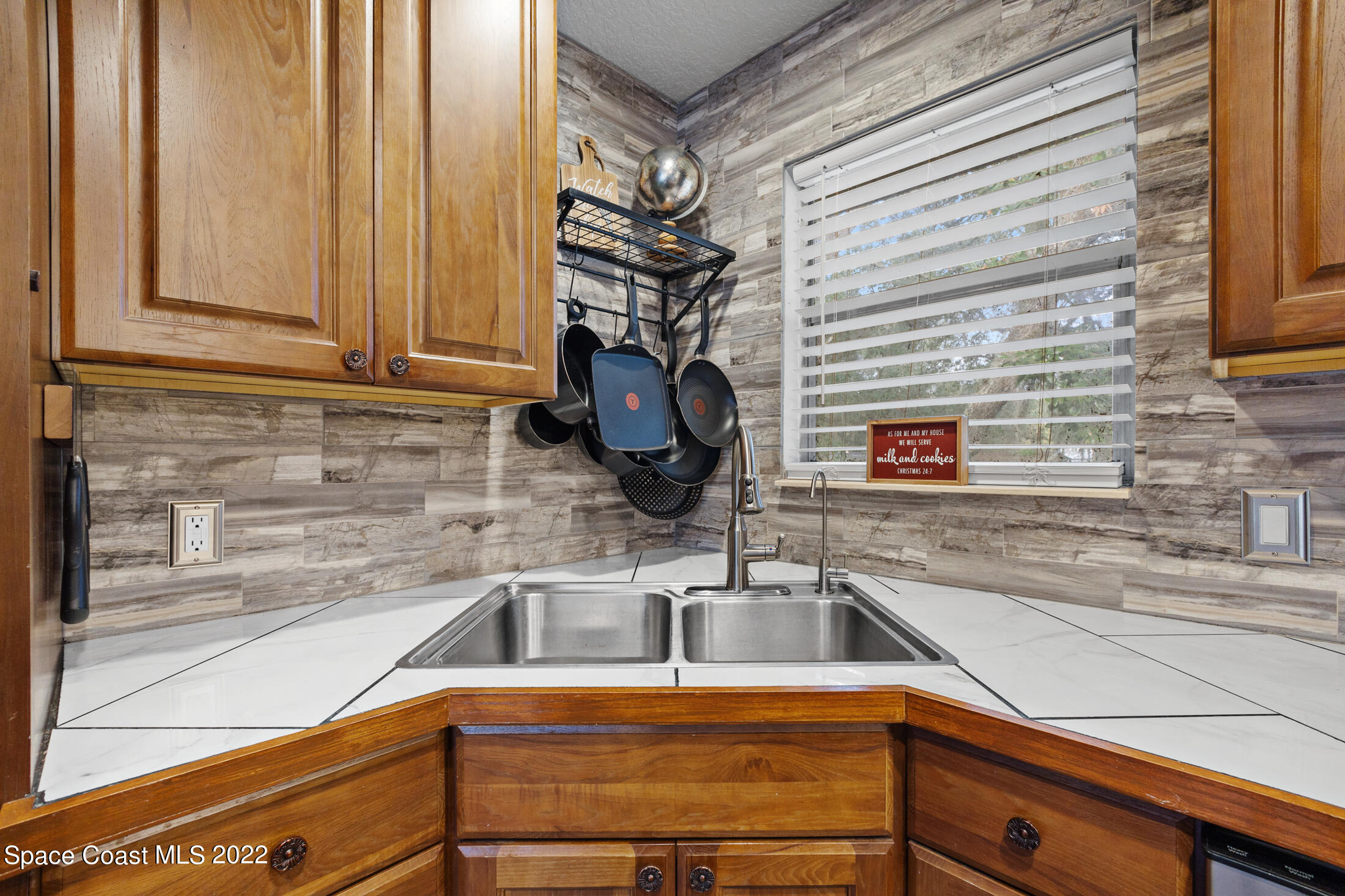 5480 Citrus Boulevard Cocoa, FL 32926 - Photo 17 of 43 a kitchen with a sink and a window