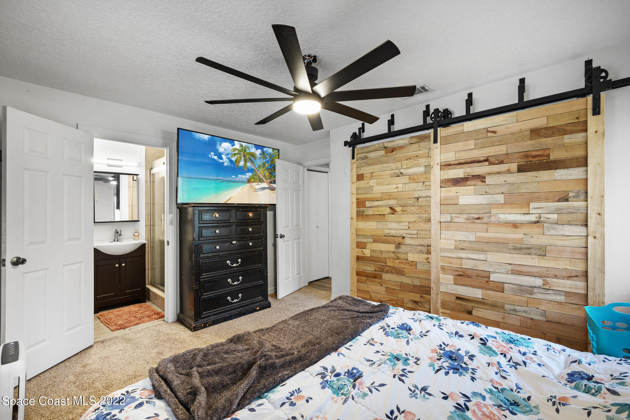 5480 Citrus Boulevard Cocoa, FL 32926 - Photo 19 of 43 a bedroom with a bed and a dresser