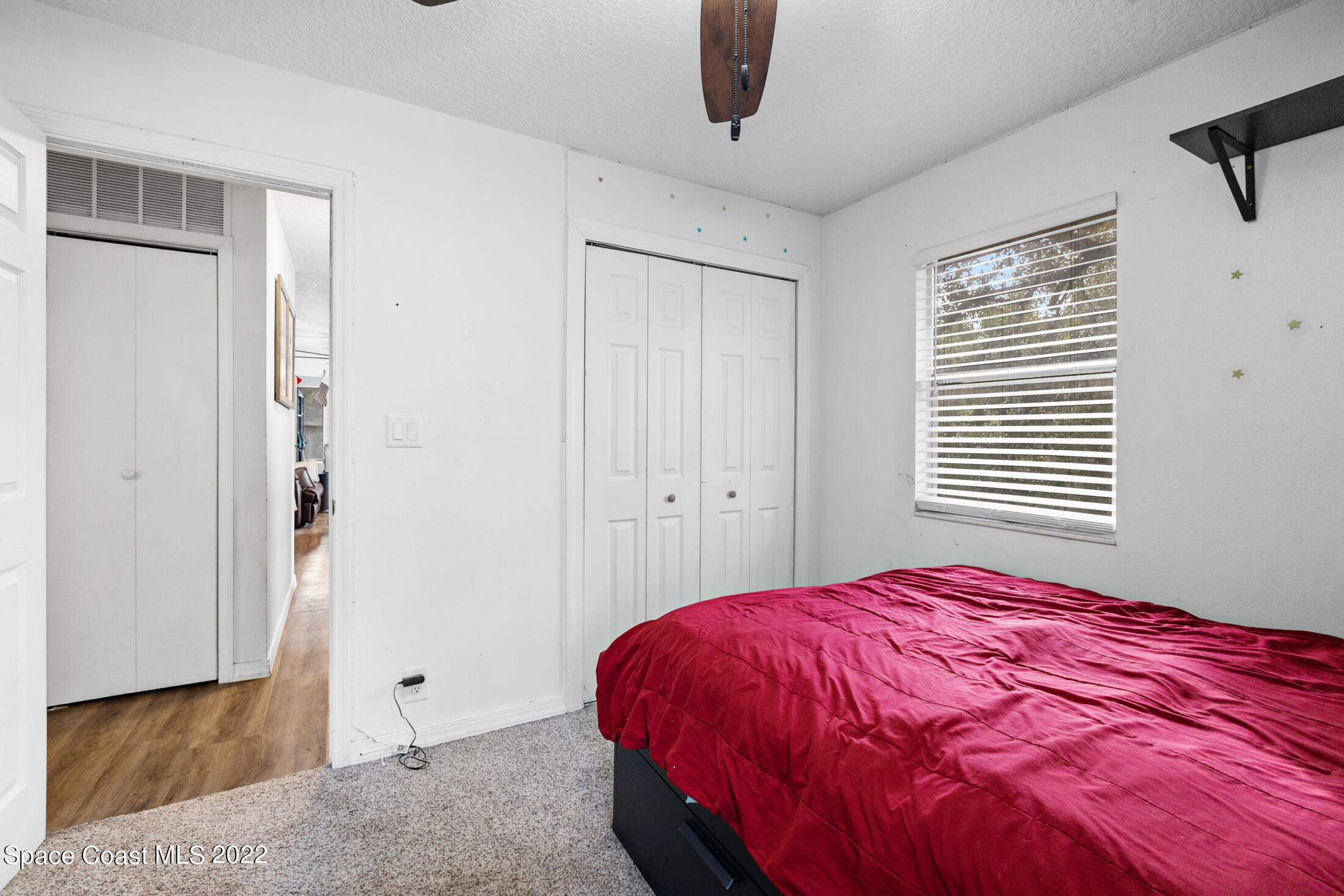 5480 Citrus Boulevard Cocoa, FL 32926 - Photo 23 of 43 a bedroom with a bed and cabinets