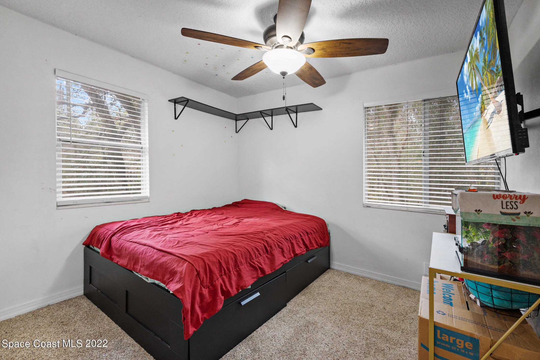 5480 Citrus Boulevard Cocoa, FL 32926 - Photo 24 of 43 a bedroom with a bed and a window