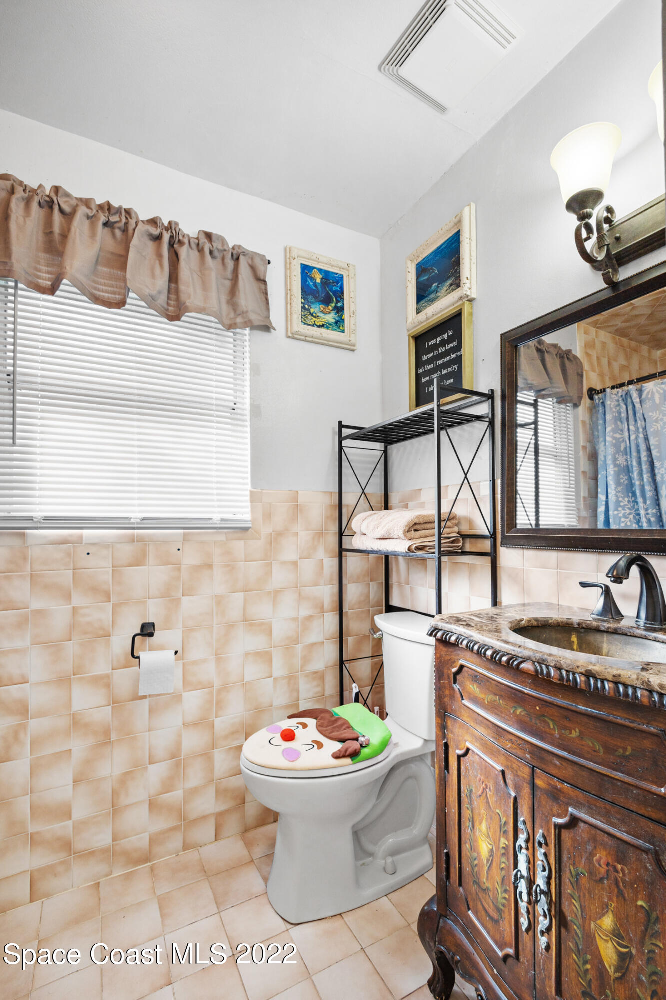 5480 Citrus Boulevard Cocoa, FL 32926 - Photo 26 of 43 a bathroom with a toilet sink and mirror