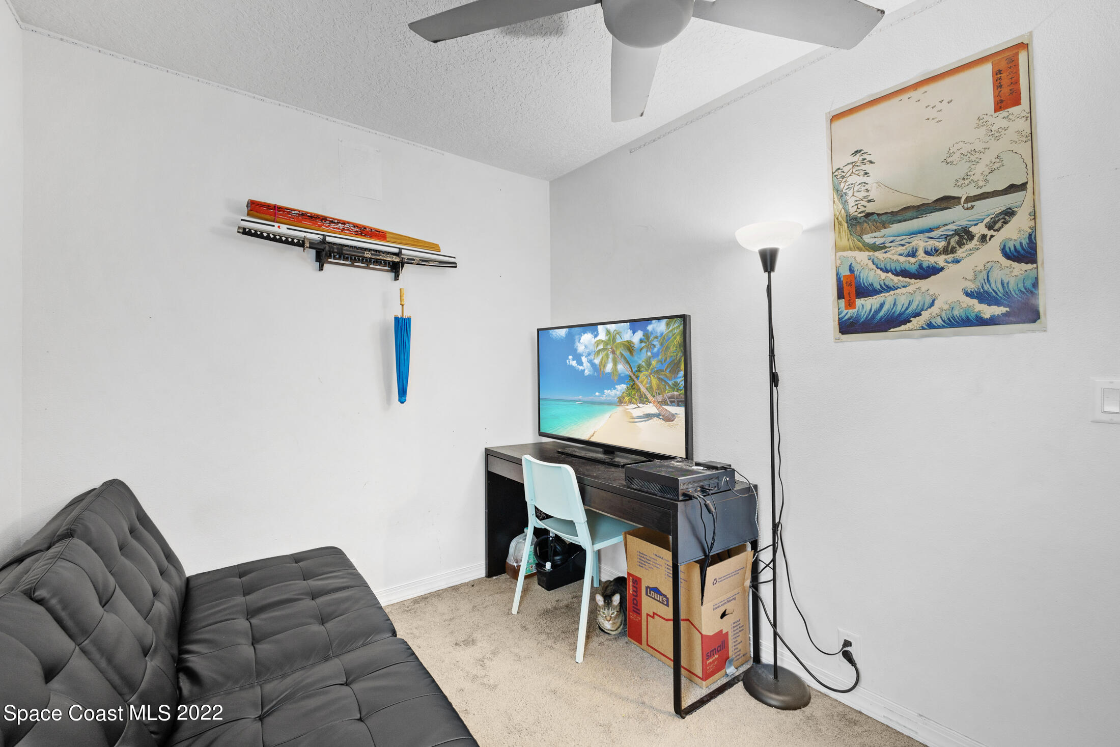 5480 Citrus Boulevard Cocoa, FL 32926 - Photo 27 of 43 a workspace with furniture and painting on the wall