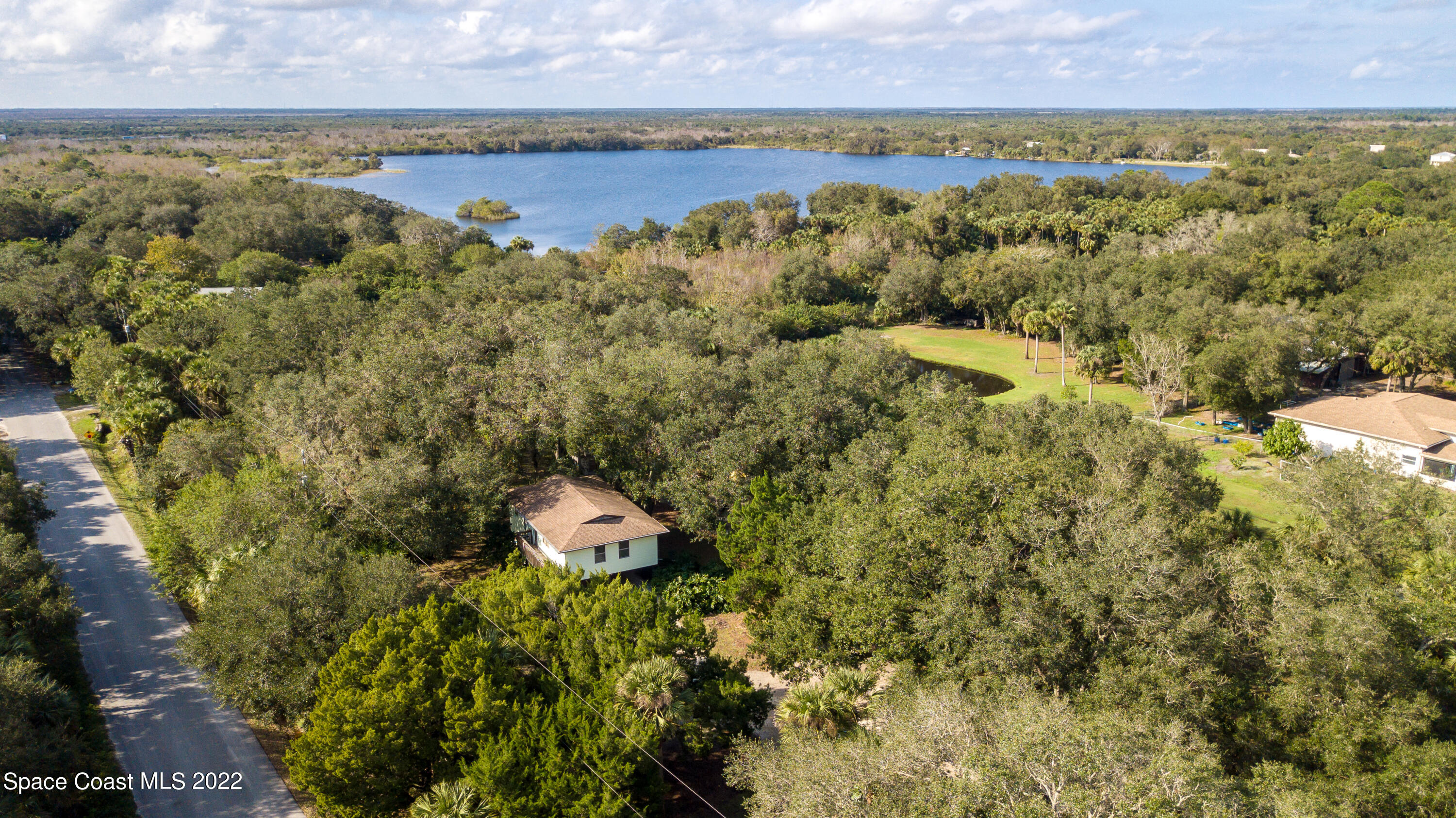 5480 Citrus Boulevard Cocoa, FL 32926 - Photo 43 of 43 a view of a lake from a yard