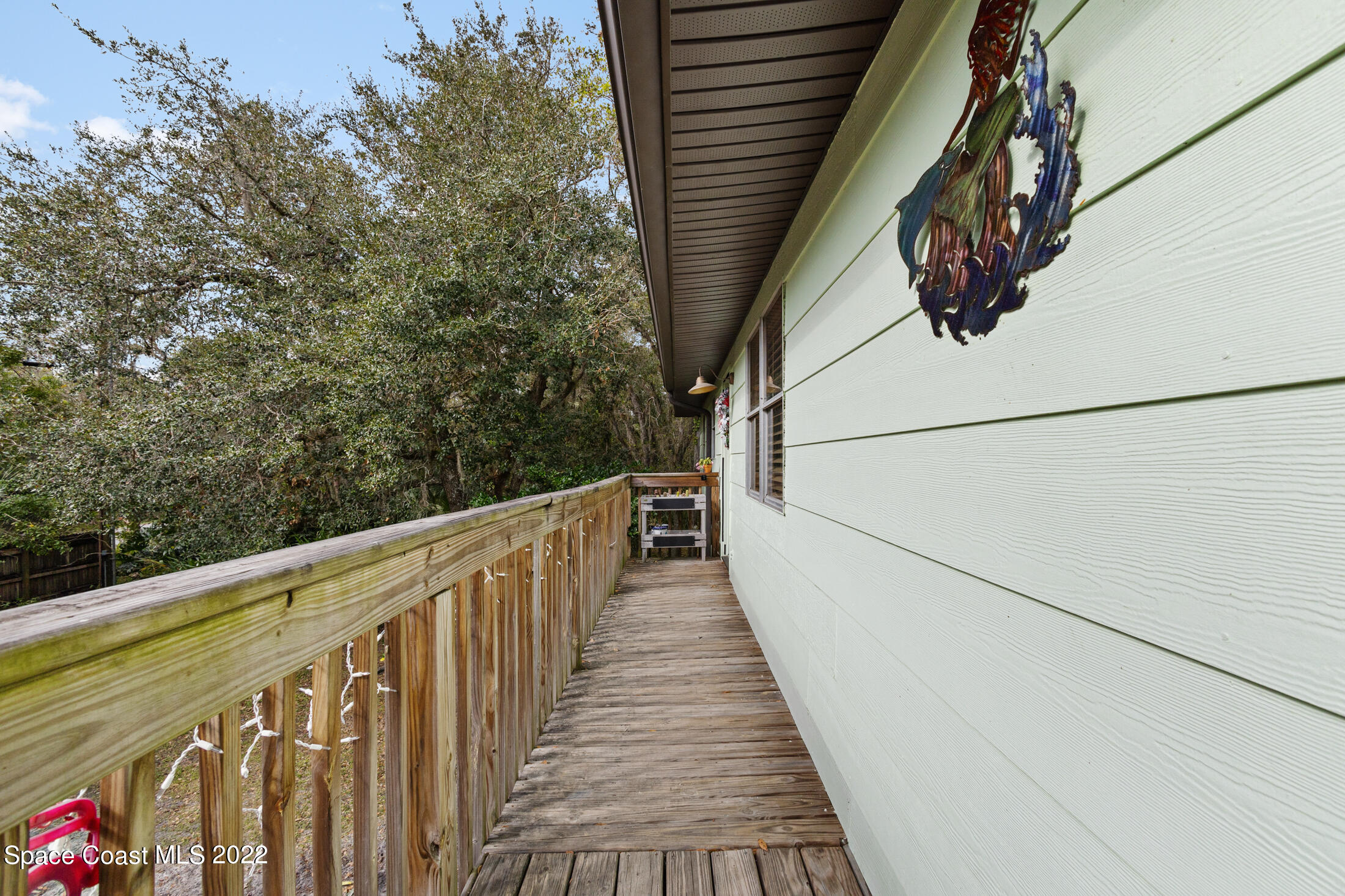 5480 Citrus Boulevard Cocoa, FL 32926 - Photo 5 of 43 a view of a balcony with wooden floor and stairs