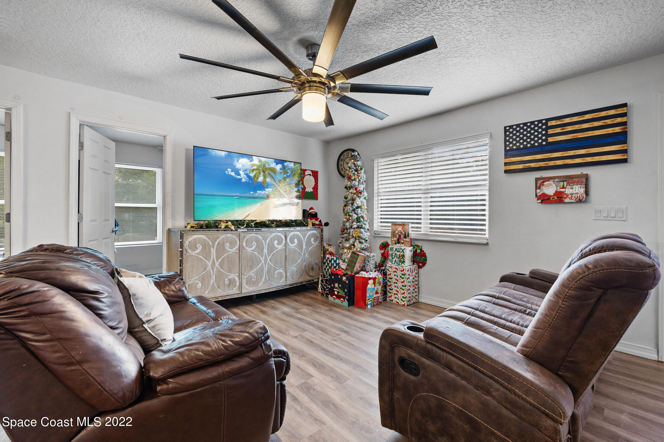 5480 Citrus Boulevard Cocoa, FL 32926 - Photo 9 of 43 a living room with furniture ceiling fan and a window