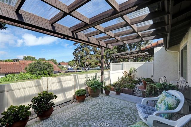 a front view of house with yard and seating space