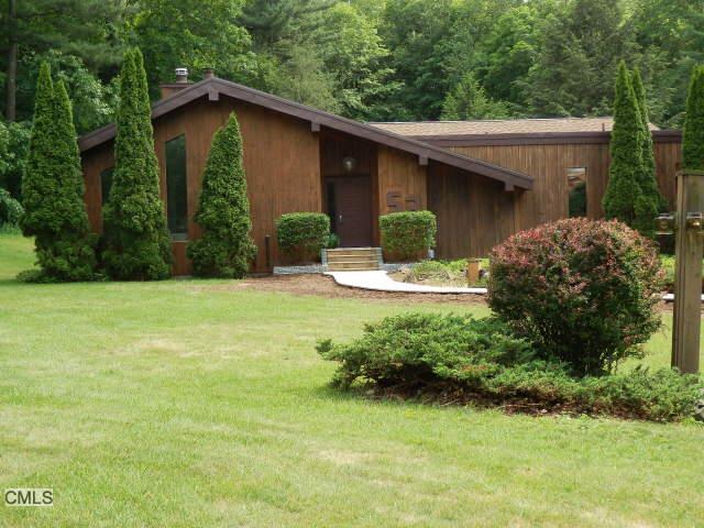 53 Whispering Pine Road Monroe, CT 06468 - Photo 1 of 1 a view of a house with a yard and plants