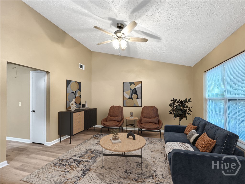 33 Quail Forest Drive Savannah, GA 31419 - Photo 6 of 21 Virtually Staged Great Room, with vaulted ceiling, new paint and new flooring