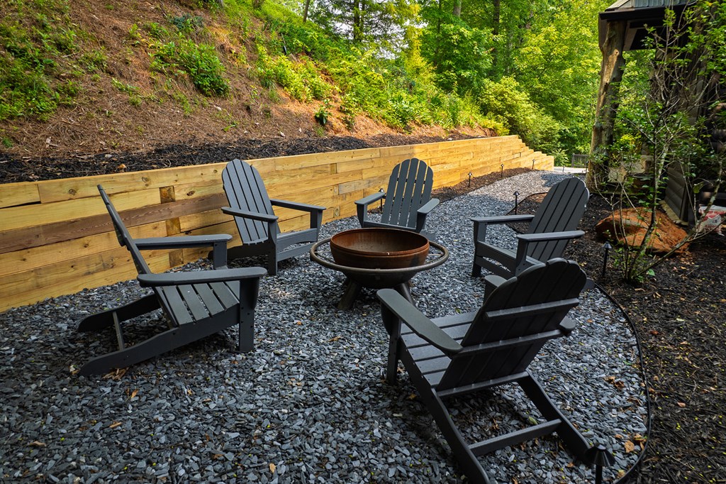 239 Ridge Top Drive Ellijay, GA 30536 - Photo 17 of 92 a backyard of a house with table and chairs