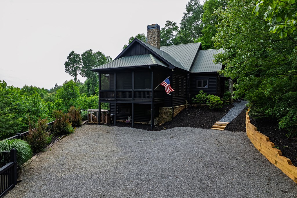 239 Ridge Top Drive Ellijay, GA 30536 - Photo 24 of 92 a view of a house with backyard and sitting area