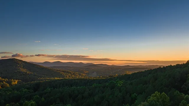 a bed room with a bed and a large window