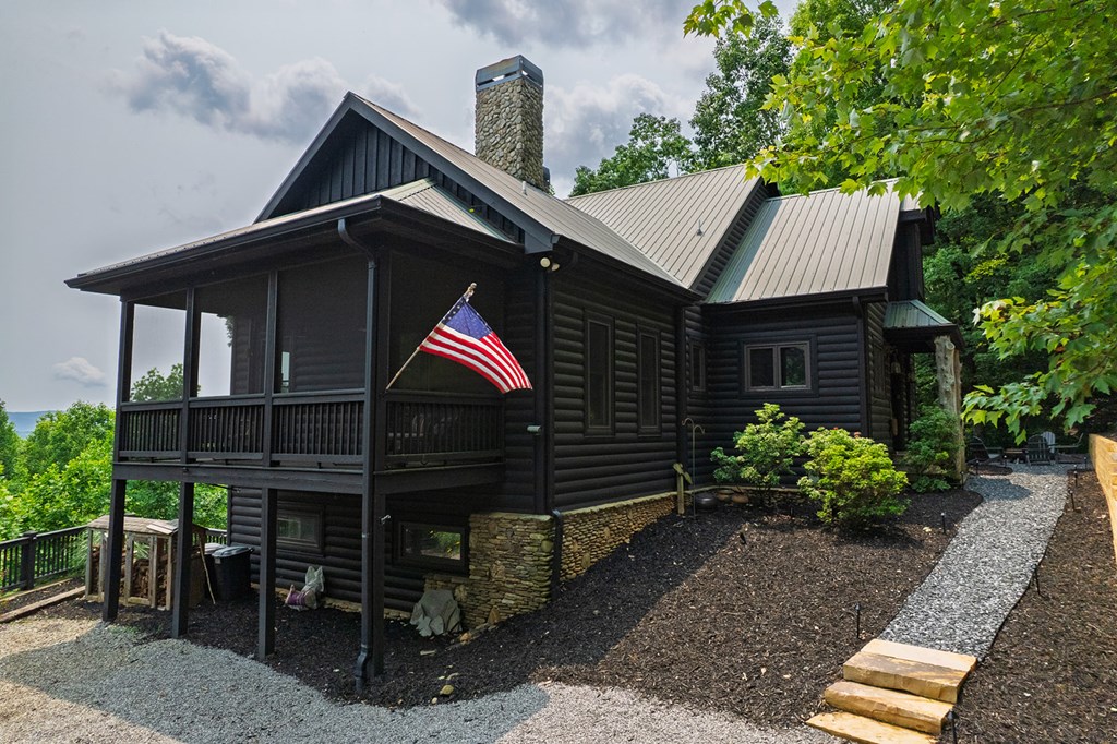 239 Ridge Top Drive Ellijay, GA 30536 - Photo 3 of 92 a front view of a house with a yard