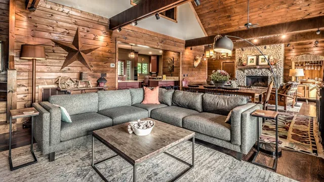 a living room with furniture and a chandelier