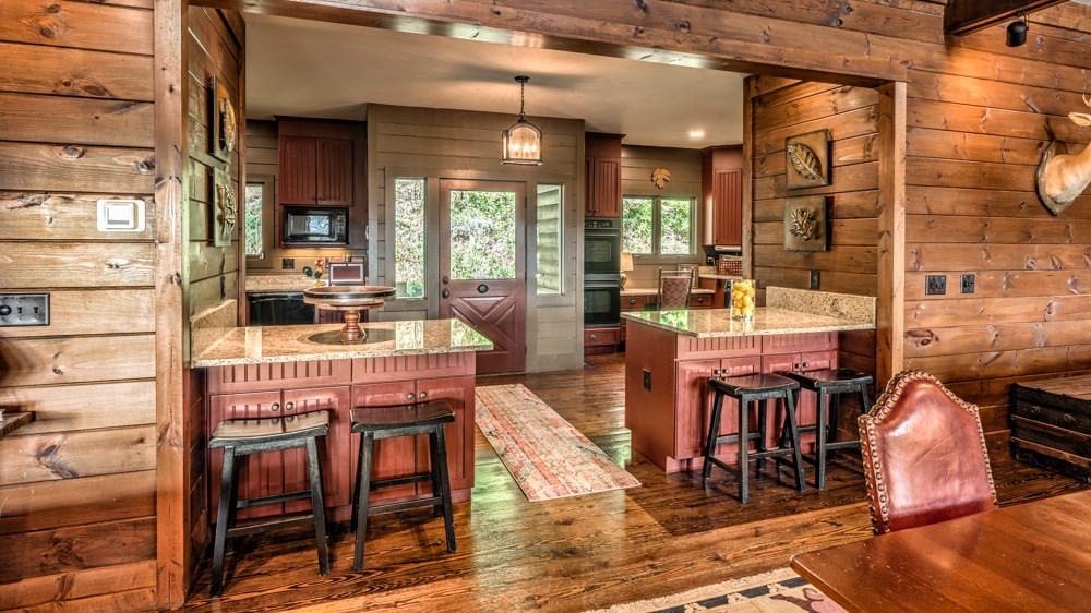 239 Ridge Top Drive Ellijay, GA 30536 - Photo 42 of 92 a view of a dining room with furniture window and wooden floor