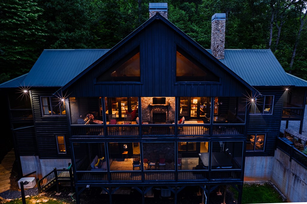 239 Ridge Top Drive Ellijay, GA 30536 - Photo 5 of 92 a front view of a house with barbeque and trees