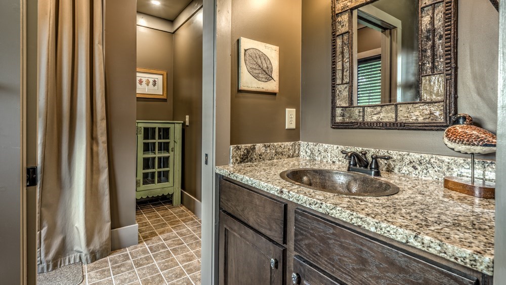239 Ridge Top Drive Ellijay, GA 30536 - Photo 75 of 92 a bathroom with a sink and a mirror