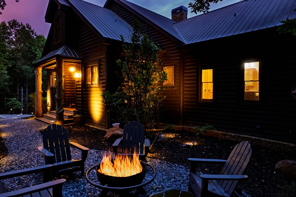 239 Ridge Top Drive Ellijay, GA 30536 - Photo 9 of 92 a backyard of a house with table and chairs
