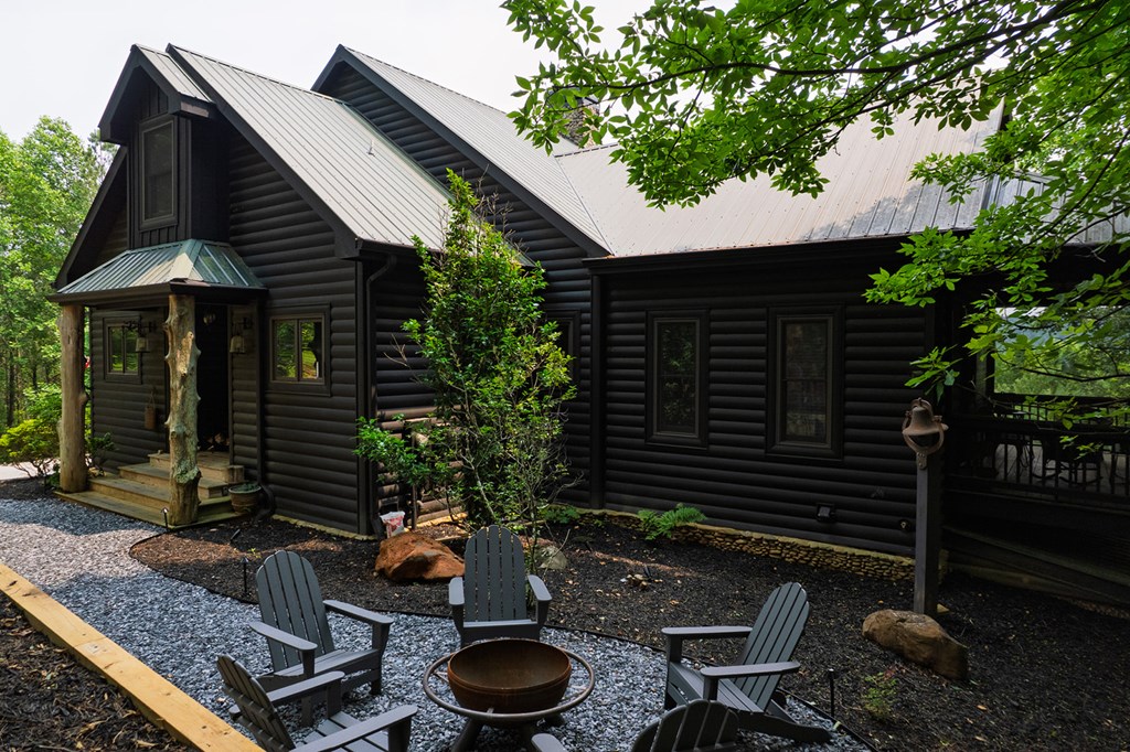 239 Ridge Top Drive Ellijay, GA 30536 - Photo 10 of 92 a backyard of a house with seating space