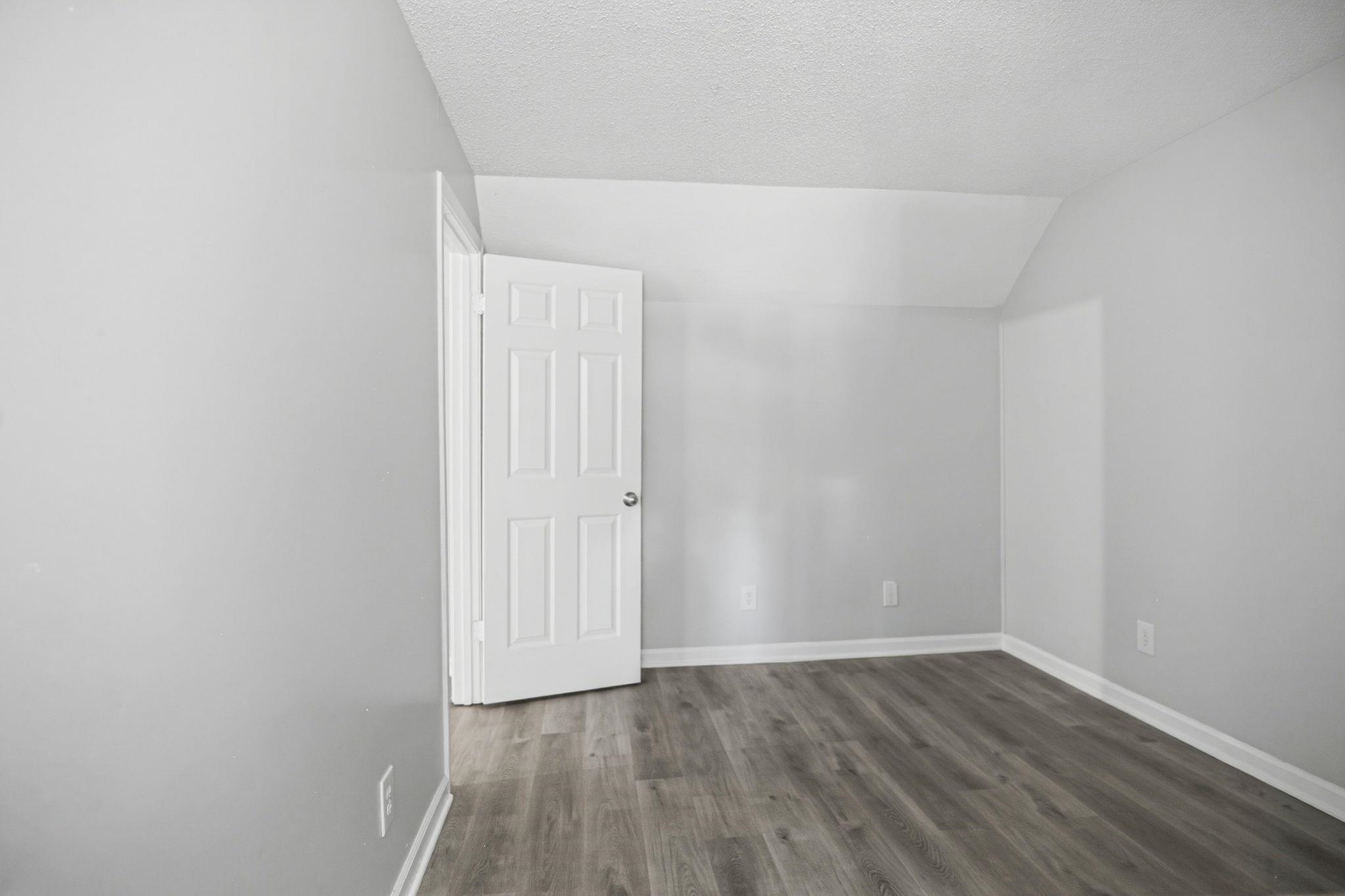 3113 Raleigh Ridge Cove Memphis, TN 38128 - Photo 30 of 38 Room featuring wood-finish flooring and light gray painted walls