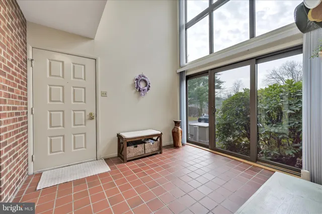 a view of an empty room with windows