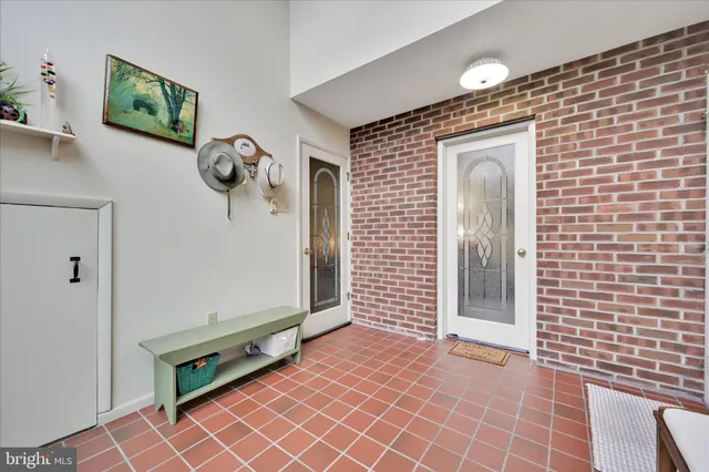 a view of a hallway with front door