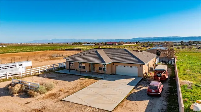 an aerial view of a house with a ocean view