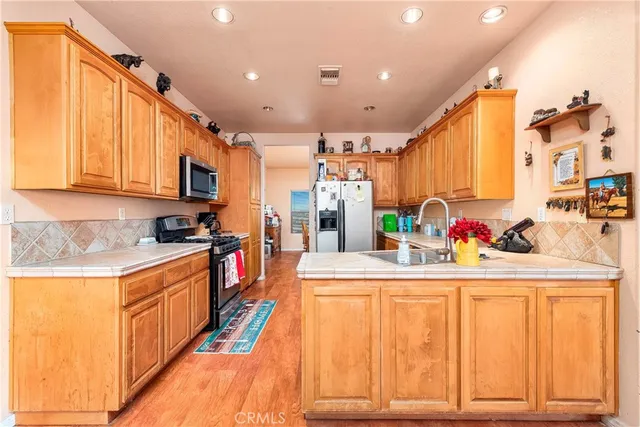 a bathroom with a tub a sink and a shower