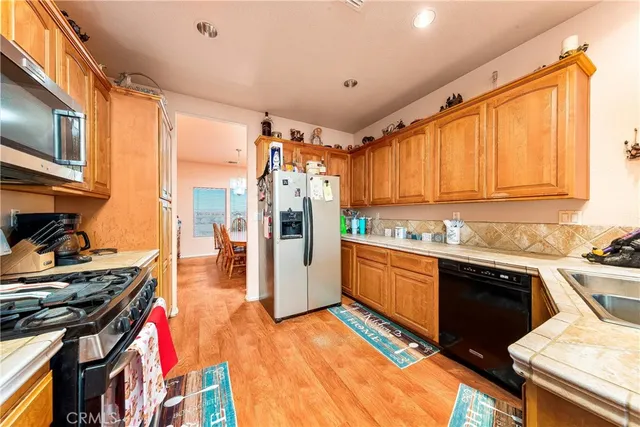 a spacious bathroom with a glass shower door and a sink