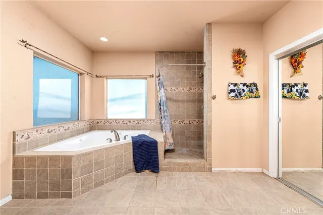 a bathroom with a double vanity sink toilet and a mirror