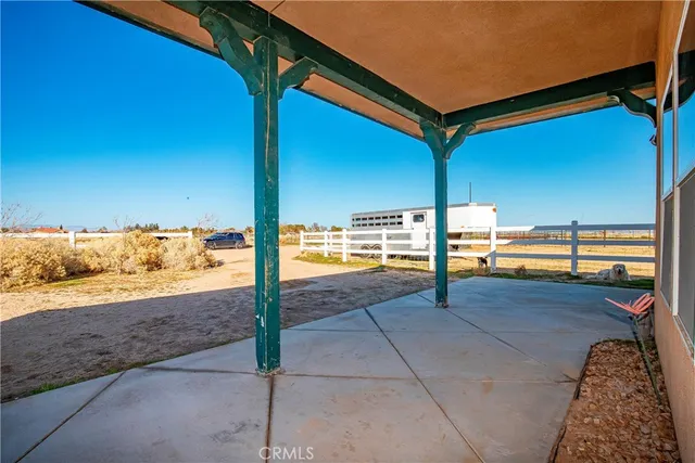 a view of a floor to ceiling window and an outdoor space