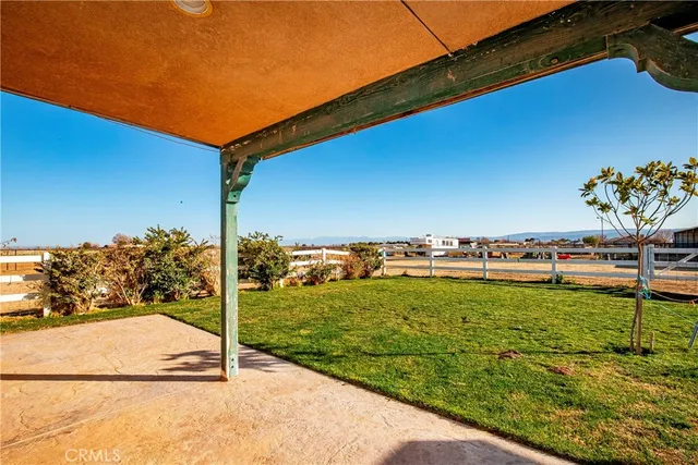 a swimming pool with lawn chairs