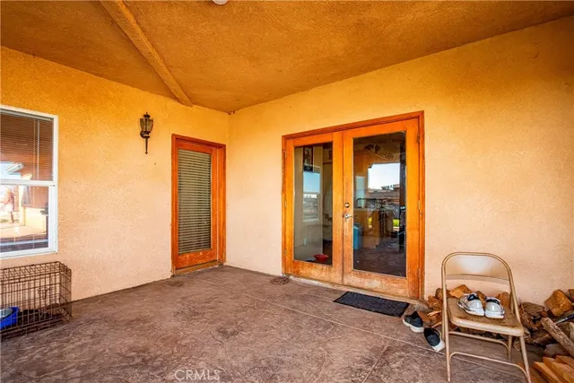 a view of a backyard with wooden fence